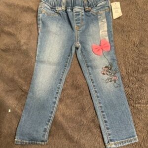 Girl’s jeans with Minnie Mouse and bow